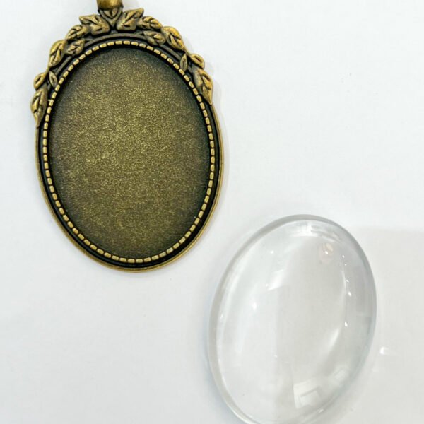 Oval Ornament Metallic Frame Pendant